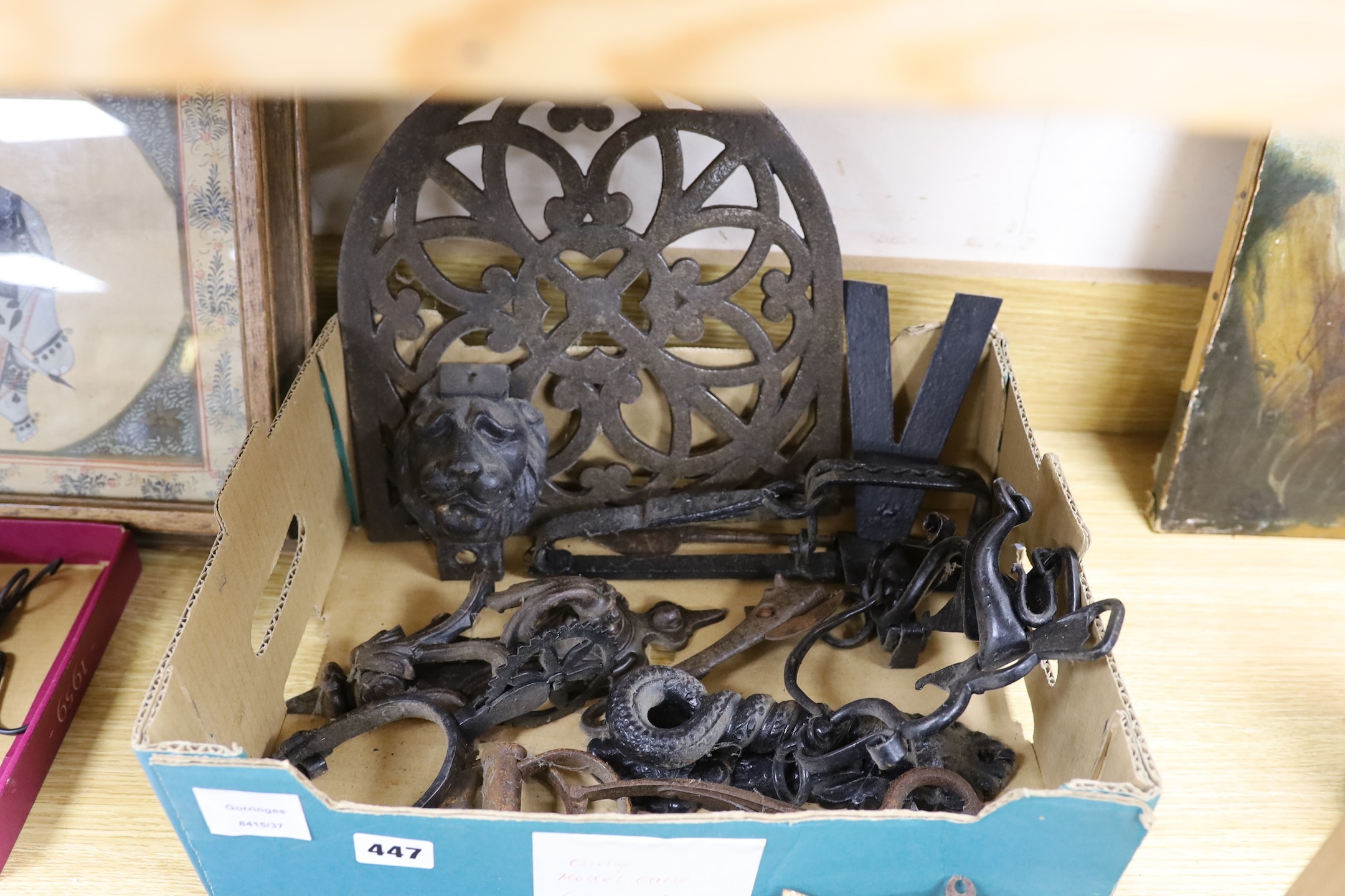 A mixed collection of iron mounts, dial elements, a trap, two fire marks etc